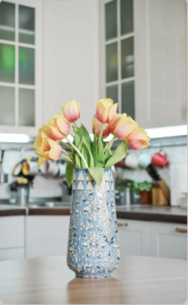 Fresh flowers arranged in a bright kitchen