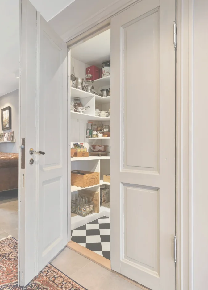 A dedicated pantry organized with guest supplies