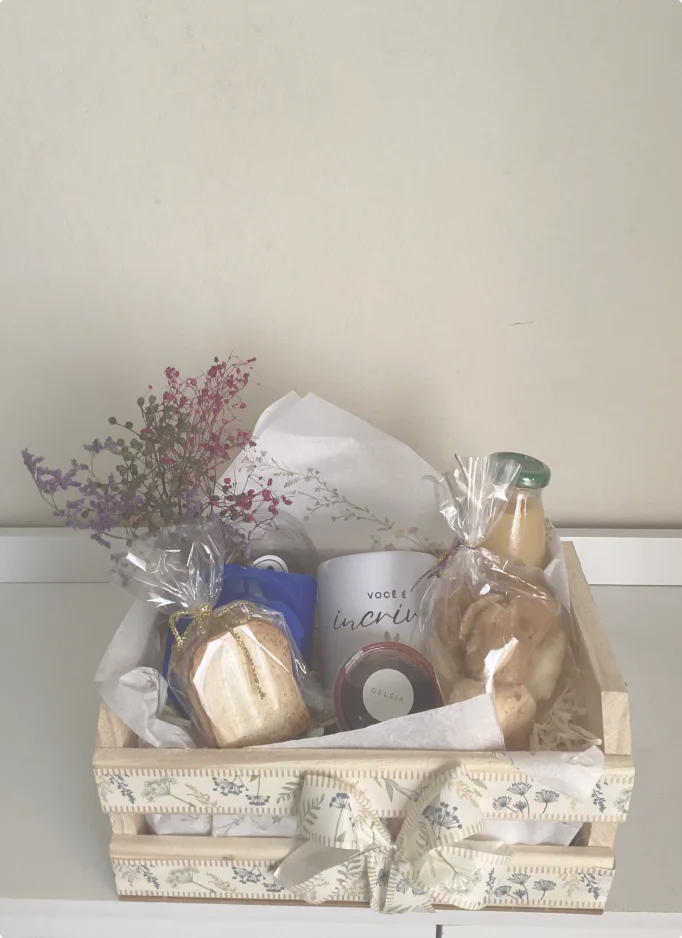 A curated welcome gift crate with treats and flowers